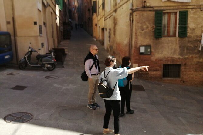 Siena Private Walking Tour: Traditions, Streets & Cathedral - Torre del Mangia: why the tower is the height it is